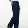 Jeans Tscinch a vita bassa e gamba larga